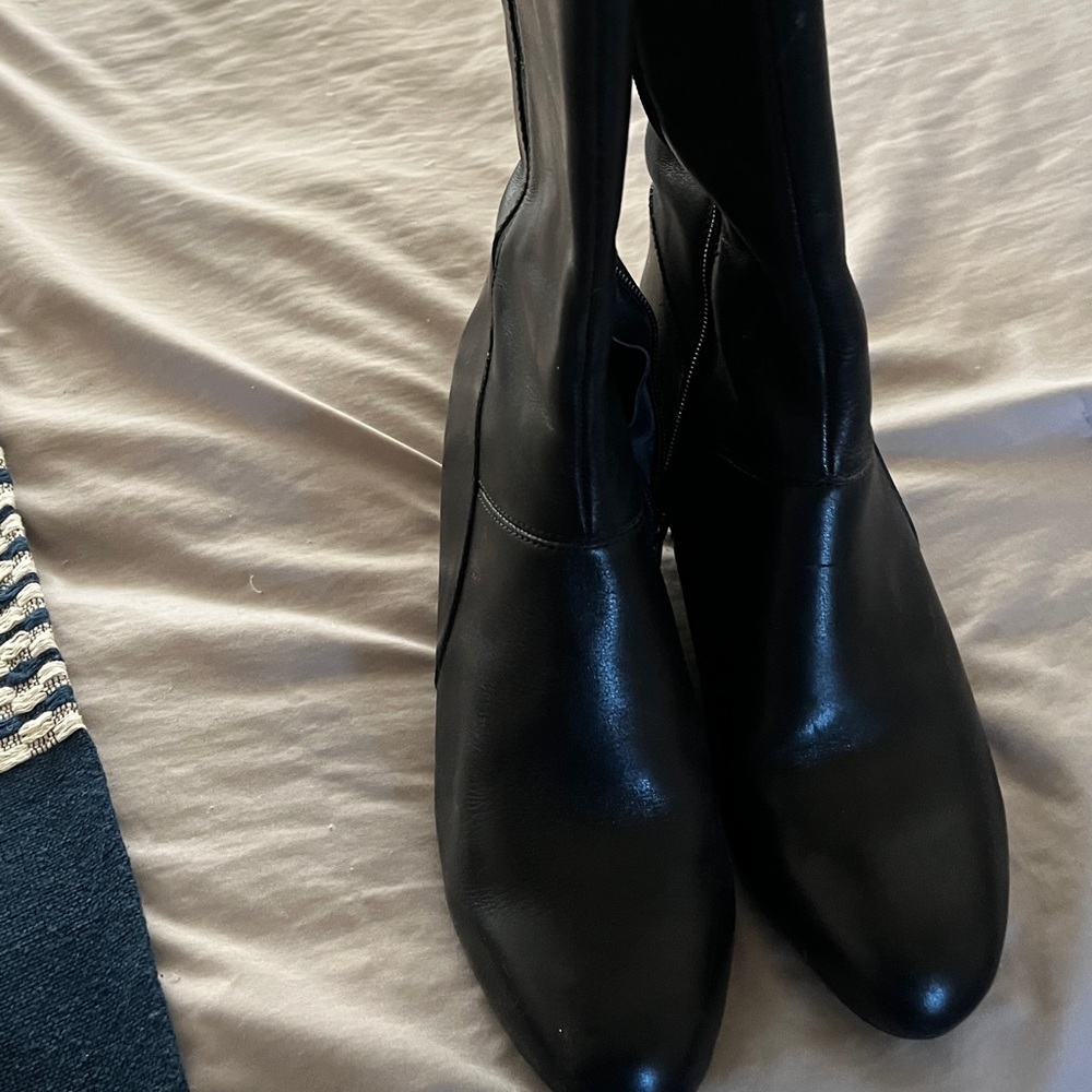 Tall, wedge style boots.